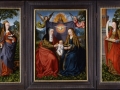 Master of Frankfurt 'The Virgin and Child seated with Saint Anne offering a pear before before a curtain held by angels, God the Father above'